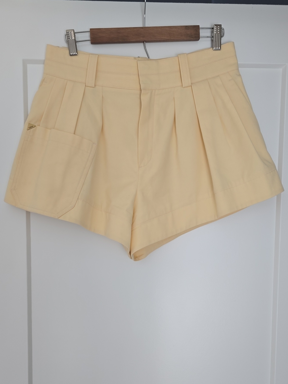 Chloe High-Waist Pleated Shorts in Pale Yellow. New
